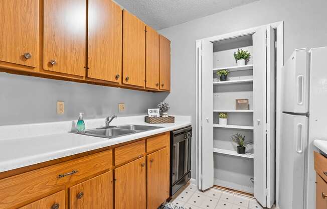 apartment kitchen with wood cabinets