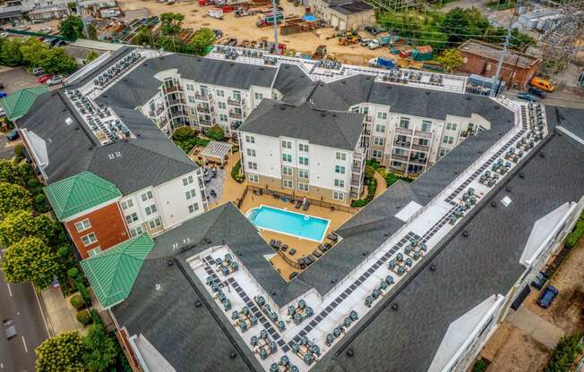 an aerial view of a large apartment complex with a swimming pool at West 130, West Hempstead New York