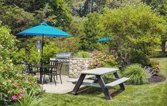 Outdoor Grilling Station with Grill, Table, and Bench