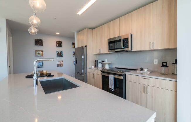 a kitchen with a large counter top and a sink