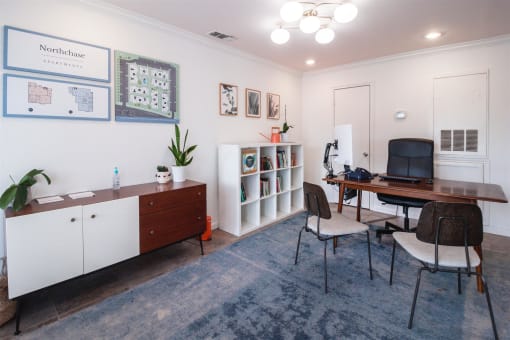 a home office with a desk and a chair and a computer