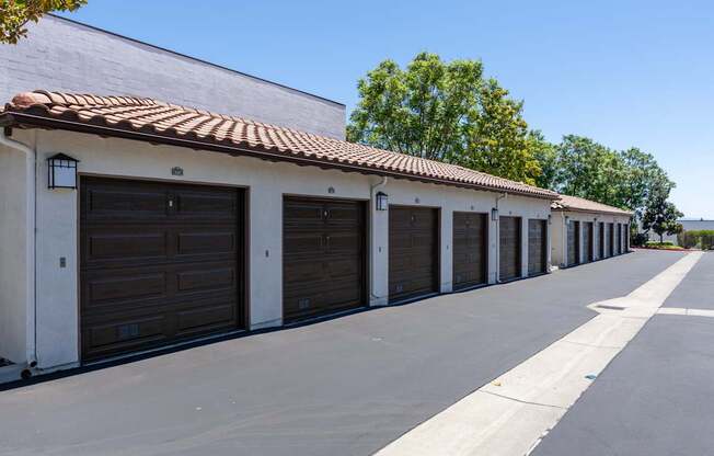 A long row of garage doors are closed.