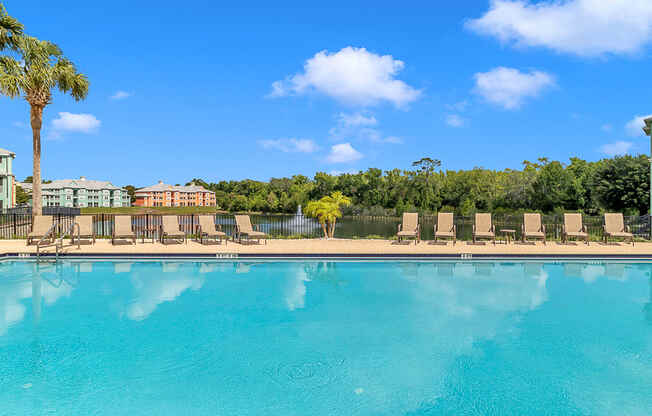 Swimming pool and sundeck at Bermuda Estates Apartments in Ormond Beach, FL
