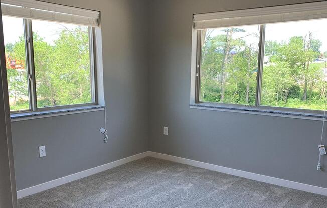 a bedroom with a large window