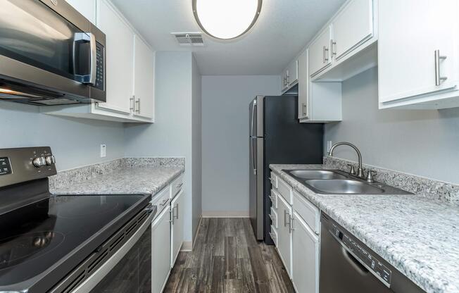 a modern kitchen with stainless steel appliances