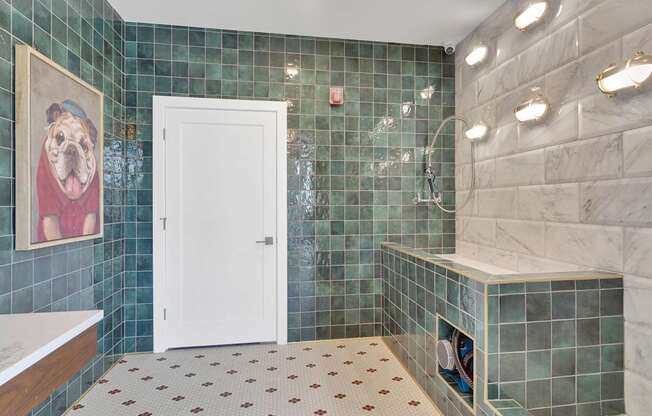A bathroom with a white door and a picture of a dog on the wall.