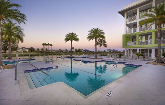 The large, tranquil pool at Residences at The Green at dusk