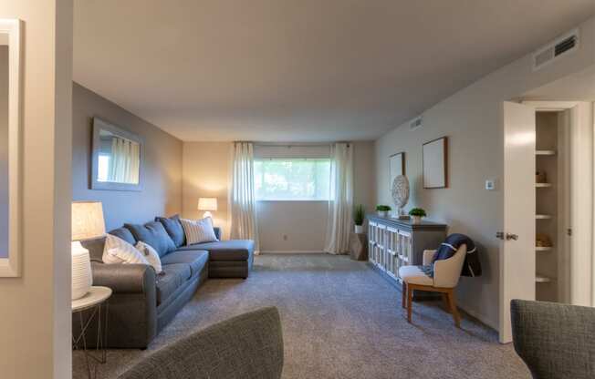 This is a photo of the living room in the 822 square foot, 2 bedroom, 1 bath floor plan at Village East Apartments in Franklin, OH.