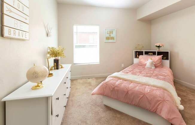 a bedroom with a bed and dresser