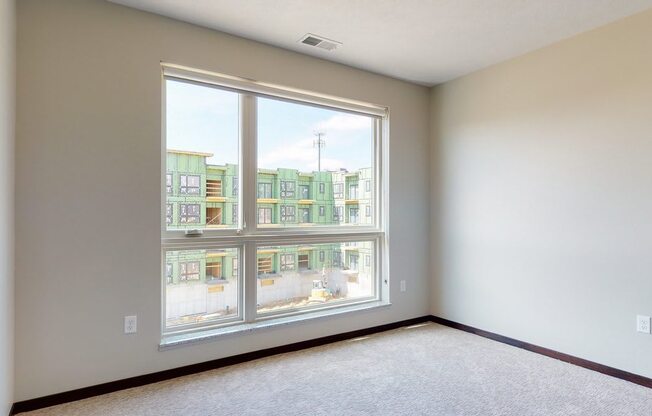 Natural light in bedroom provided by large windows at Haven at Uptown in Lincoln, NE