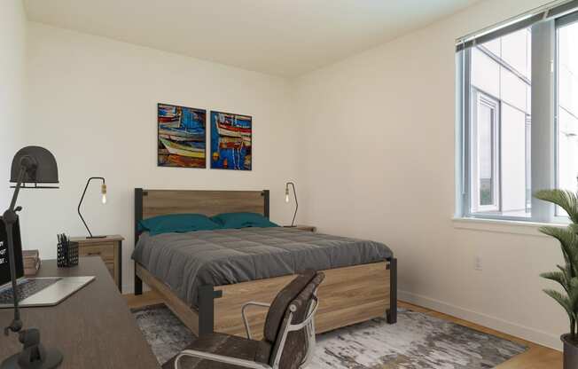 a bedroom with a bed and desk in a 555 waverly unit at Jefferson Yards, Tacoma, WA