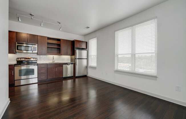 12 South Apartments - Nashville TN - kitchen with dark wood cabinets and stainless steel appliances