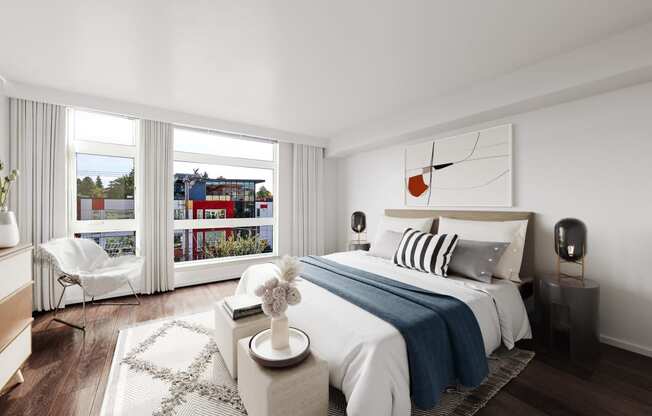 a bedroom with a bed and a large window at The Hayes on Stone Way, Seattle, Washington