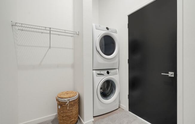 walk in closet with full size washer and dryer