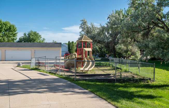 a playground in the backyard of a home