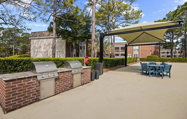 the preserve at ballantyne commons apartments patio with barbecue grill and table and chairs