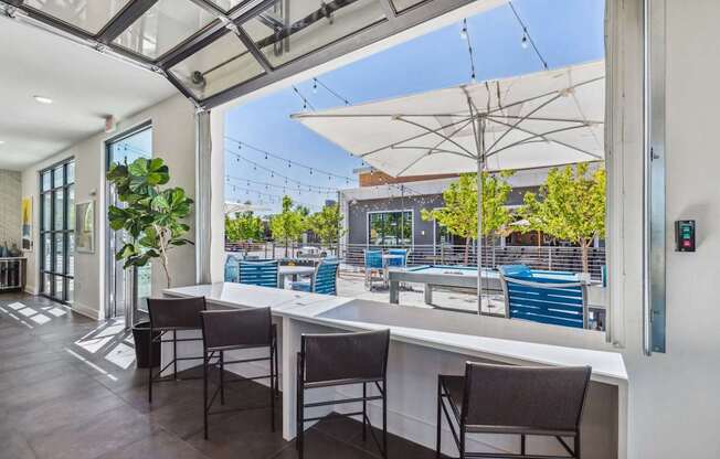 a view of the outdoor patio from inside the building