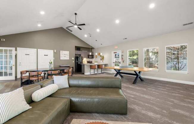 A clubhouse with a green couch and striped carpet at Clackamas Trails Apartments, Oregon, 97222