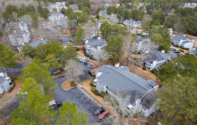 an aerial view of a neighborhood with houses and trees