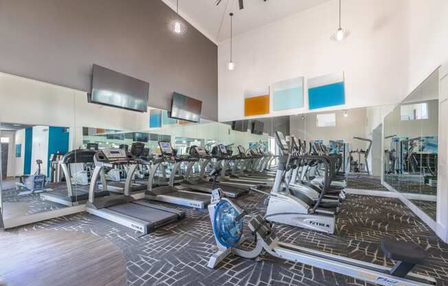 a gym with cardio machines and a glass walled room with cardio equipment  at Butternut Ridge, North Olmsted, OH