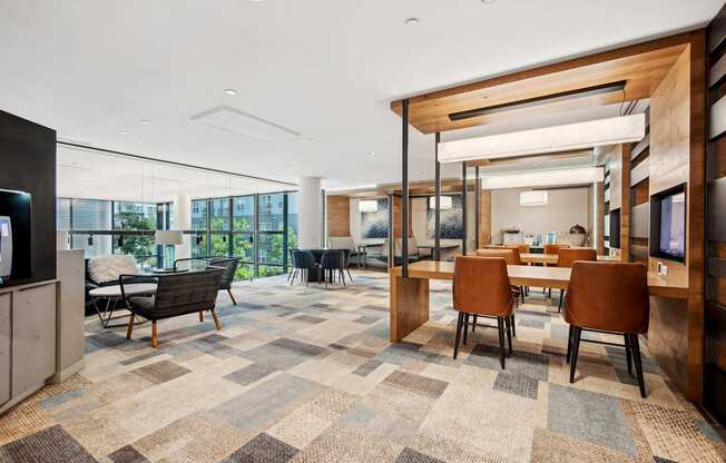 A modern office space with a large carpeted area and wooden accents.