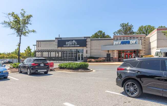 a parking lot with cars parked in front of a restaurant at Fairmont at South Lake, Bowie, MD, 20716
