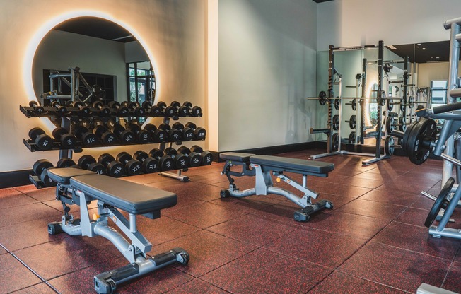 Fitness studio equipped with free weights, smith machienes, yoga studio, and more.