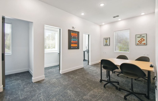 a conference room with a table and chairs in front of a window at Gibson Oaks, Lakeland, 33809