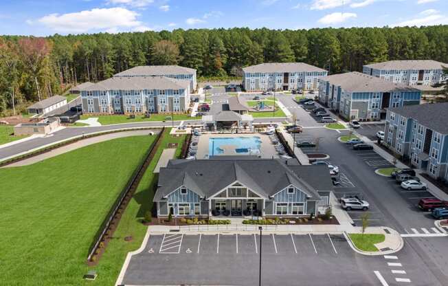 an aerial view of an apartment complex with a swimming pool