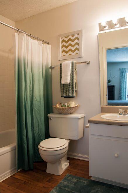 Spacious bathroom with a tub and shower at the Grove at St. Andrews,