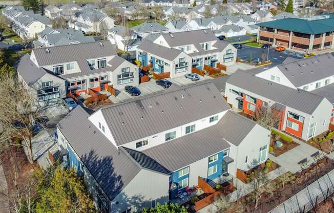 arial view of a neighborhood of houses with roofs