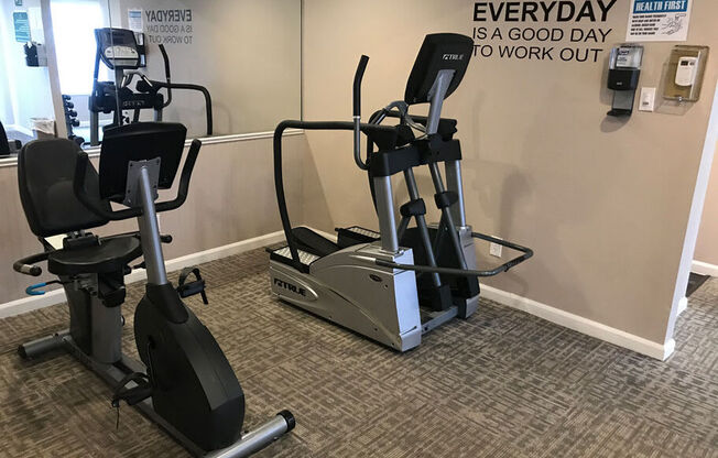 A gym room with a wall that says "Everyday is a good day to work out".