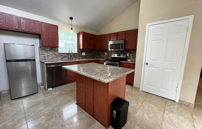 Two-Bedroom Home with Open Floor Plan and Spacious Yard: Ideal for Convenient Living!