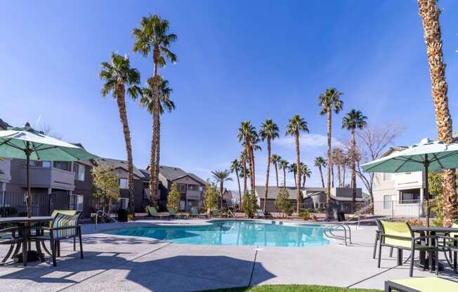 our apartments have a swimming pool and tables with umbrellas