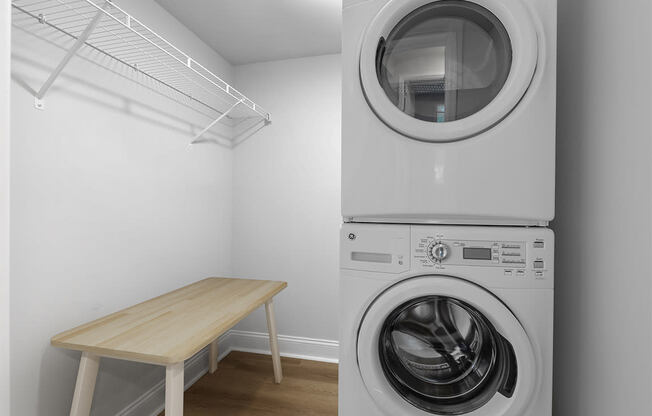 a washer and dryer in a room with a table at Padonia Village Apartments, Timonium MD