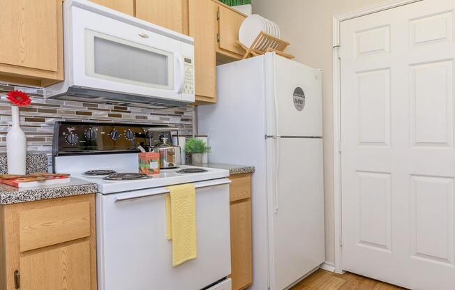 a kitchen with a stove top oven sitting inside of a refrigerator