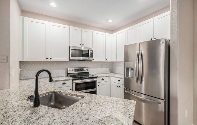 Updated 2 Bed 2 Bath Condo with One Car Garage in Littleton!