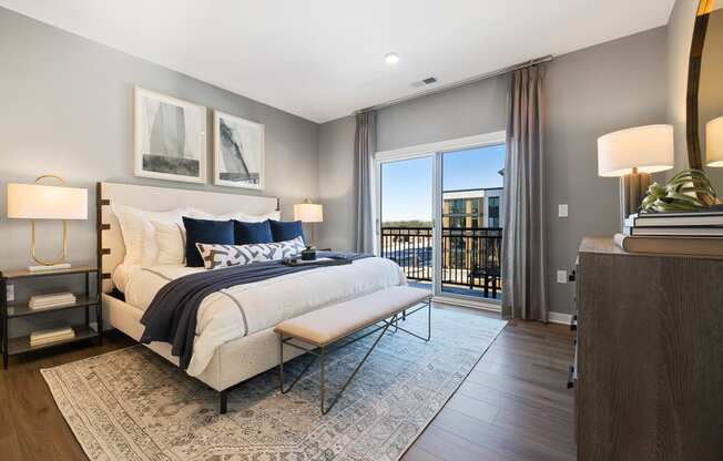 a bedroom with a bed and a sliding glass door