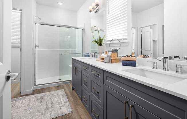 bathroom with grey cabinets and walk in shower at Solstice at Fiddyment Ranch, California, 95747