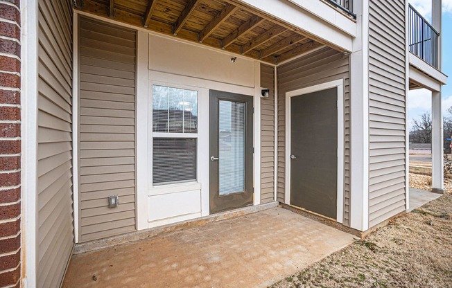 Patio with a door to enclosed storage  at Signature Pointe Apartment Homes, Athens, AL, 35611