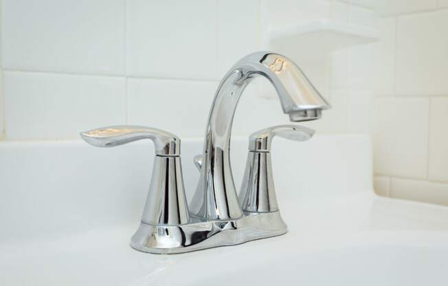 close up of bathroom sink faucet at 2801 pennsylvania apartments in washington dc