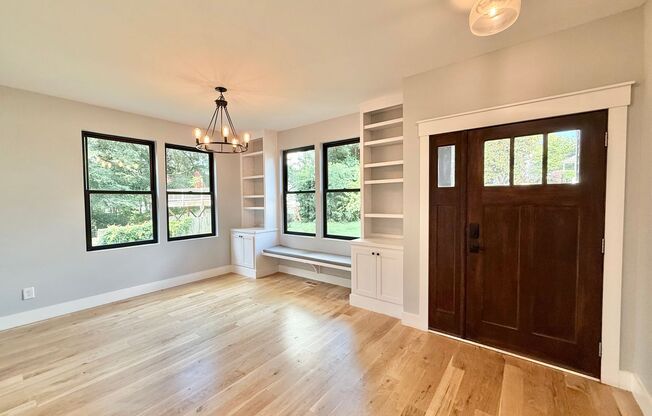 Incredible 5BD, 4.5BA Wake Forest Home Near Falls Lake with a Fully Finished Basement Living Space and a Backyard Haven Including a Large Deck, Fire Pit, and Creek