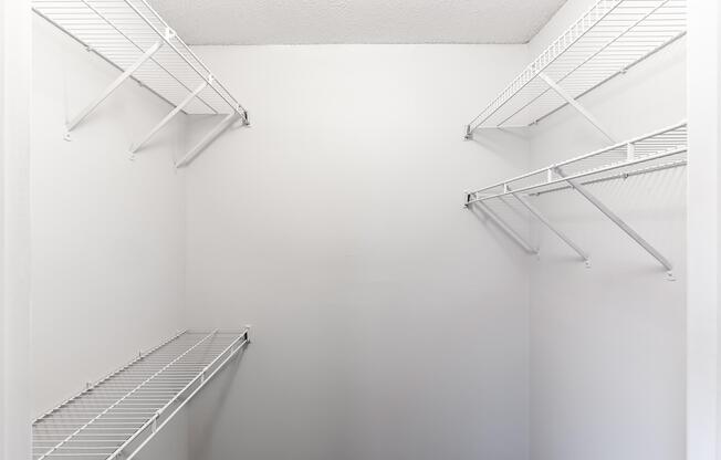 Closet interior with wire rack shelving at Ashley Oaks Apartments in Greensboro, North Carolina