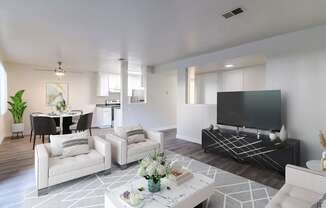 A modern living room with a black and white color scheme.