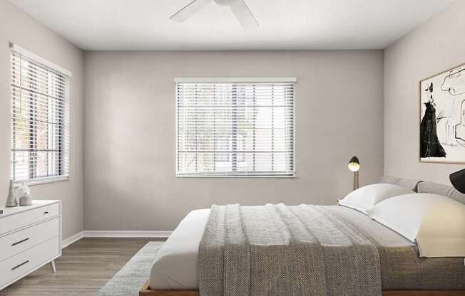 A bedroom with a bed, dresser, and window.