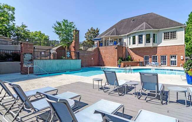 our apartments have a pool and deck with chairs