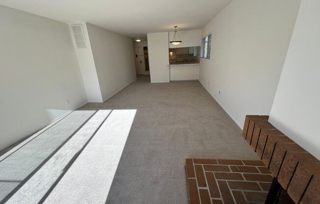 LARGE ONE BED ONE AND HALF BATH UPPER END UNIT CONDO WITH GREAT STORAGE AND TWO COVERED PARKING STALLS