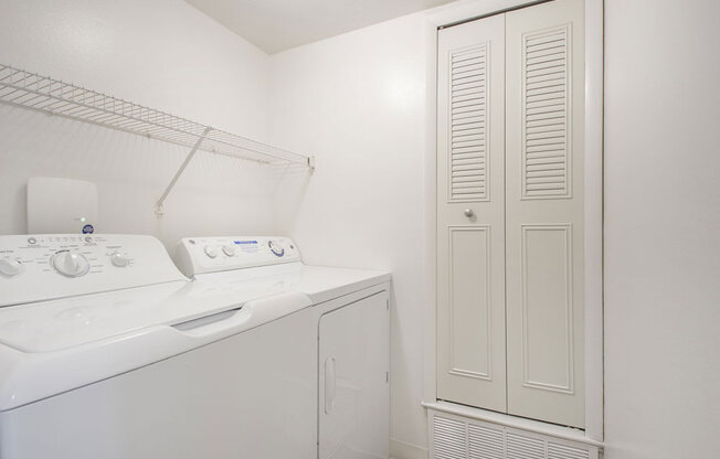 a laundry room with a washer and dryer at North Pointe Apartments in Elkhart, IN