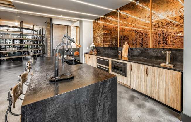 a kitchen with concrete countertops and wooden cabinets and a wine cellarat The Overlook, Winter Garden, FL, 34787