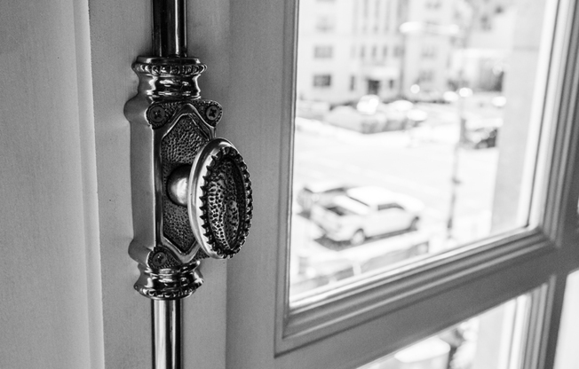 Original features remain throughout the building, including this elegant window knob.